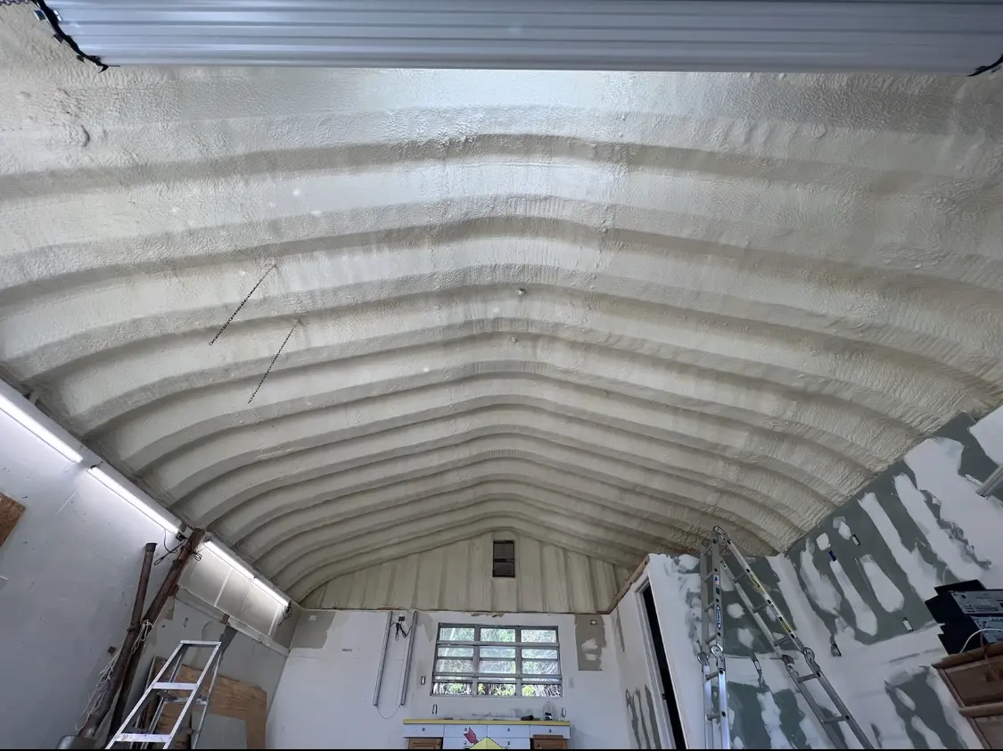 Spray polyurethane foam applied to the underside of a metal roof deck in Salisbury
